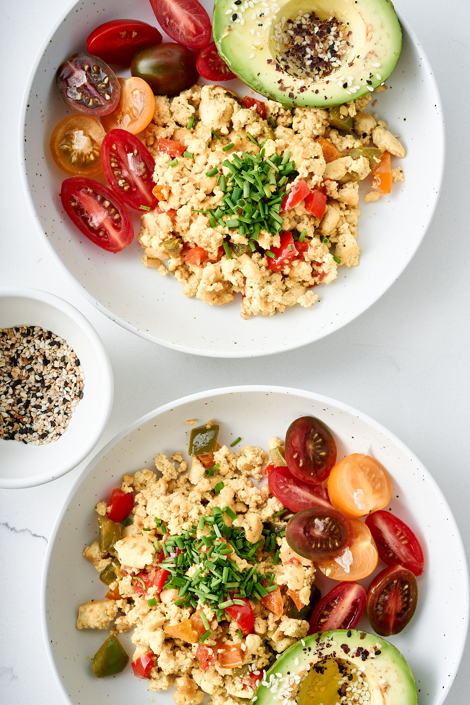 Tofu scrambled eggs with chives, tomatoes and avocado. 
