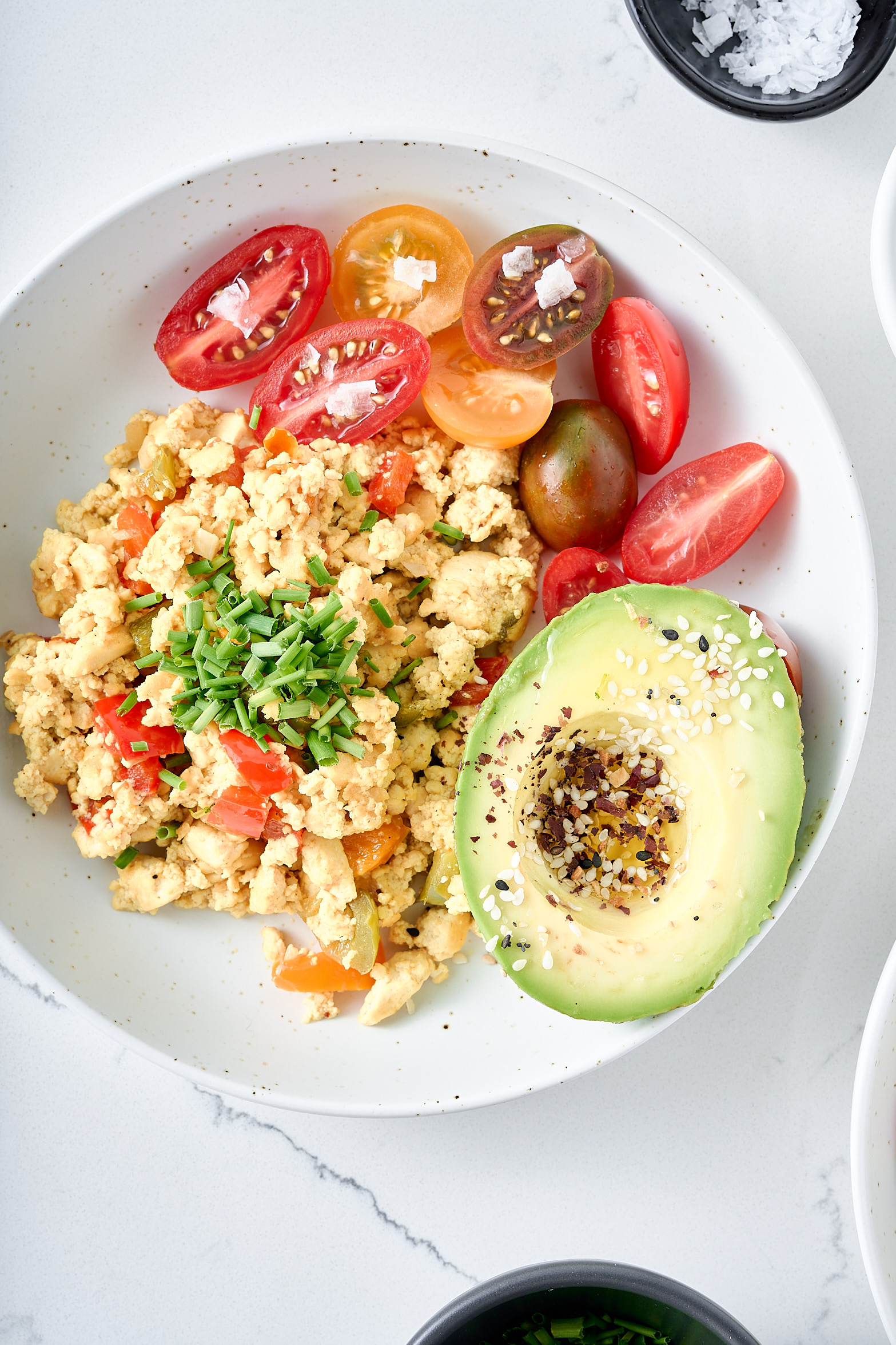 Tofu scrambled eggs with fresh cherry tomatoes. 