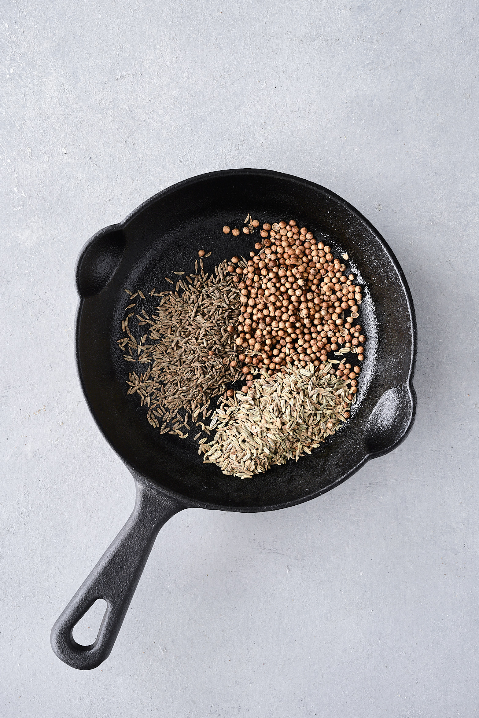 Cumin, coriander and fennel in cast iron