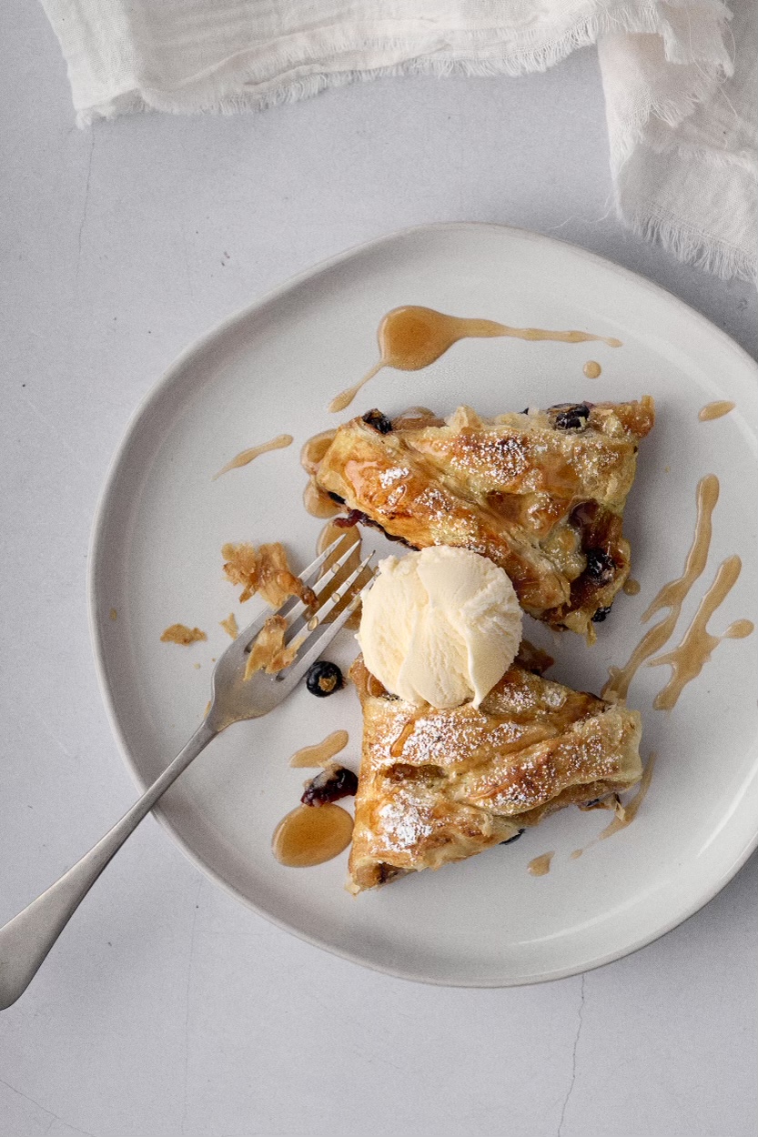 Puff pastry apple strudel served with ice cream.